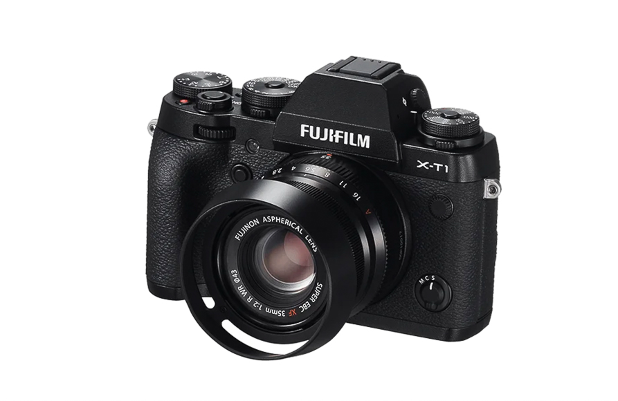 A black Fujifilm X-T1 DSLR camera with a mounted lens, featuring multiple control dials and a textured body.