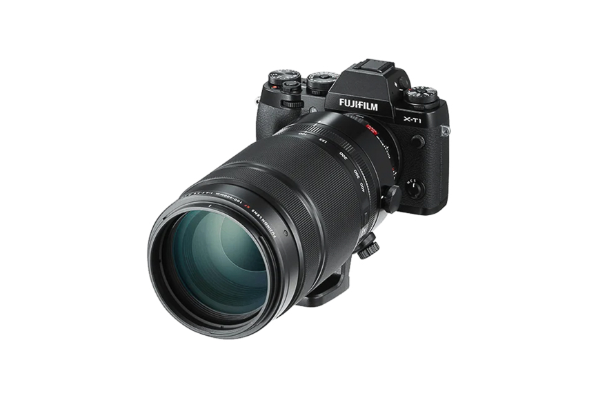 A black Fujifilm X-T1 digital camera with a large telephoto lens attached, shown on a white background.