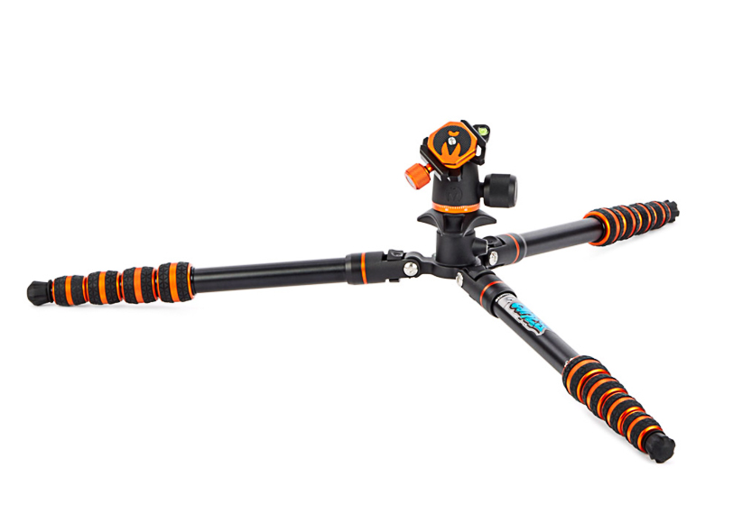 A black and orange tripod with three extended legs, designed for stability.
