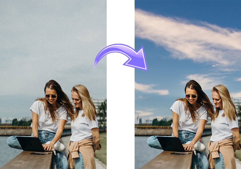 Two women sitting outdoors using a laptop. An arrow indicates a sky enhancement; the sky goes from dull to bright blue. Two women sitting outdoors using a laptop. An arrow indicates a sky enhancement; the sky goes from dull to bright blue.