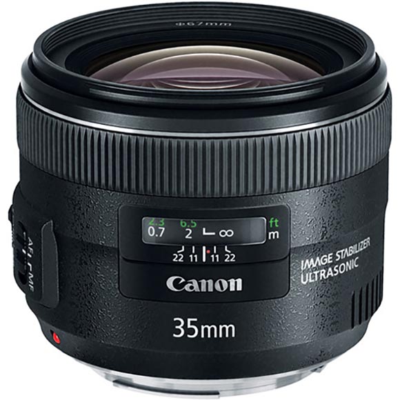 A Canon 35mm camera lens with a black, cylindrical design and labeling for image stabilization and ultrasonic features.