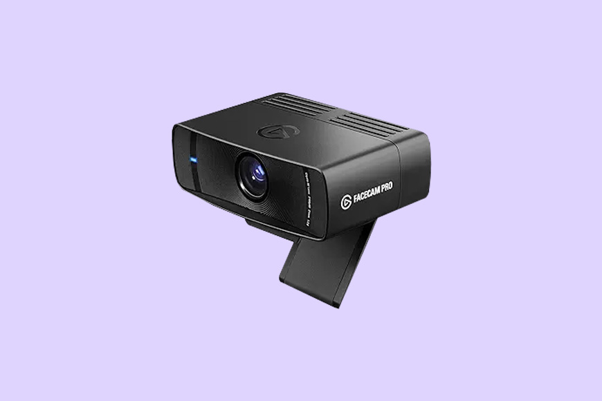 A black webcam with a rectangular design and a front lens, featuring the text "FACECAM PRO" on a side panel, set against a light purple background.