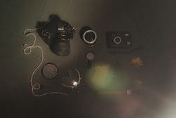A camera is laying on a table.