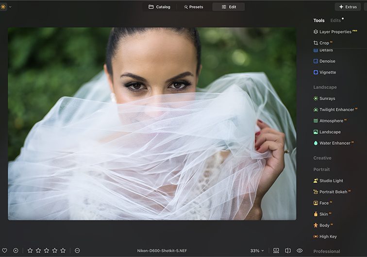 Image of a photo editing software interface displaying a portrait of a person partially covered by a translucent white fabric, with adjustment tools visible on the right side. Image of a photo editing software interface displaying a portrait of a person partially covered by a translucent white fabric, with adjustment tools visible on the right side.
