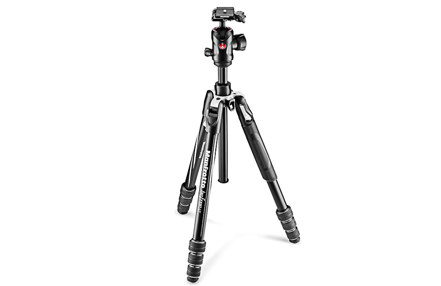 A black camera tripod with adjustable legs and a compact head.