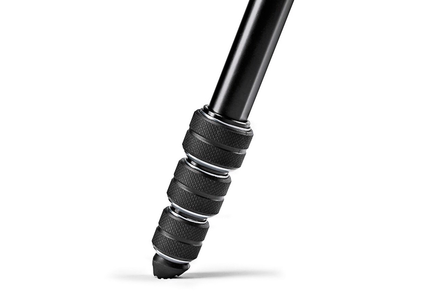 Close-up of a black adjustable tripod leg with textured grips and three locking segments.
