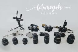 Assortment of photography equipment including cameras, lenses, and drones on a white background, with "fotomegah photography" text overlay.