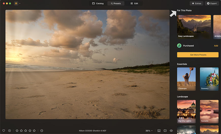 A photo editing application with a landscape image of a sandy beach at sunset on the screen. The sidebar shows different editing presets and options.
