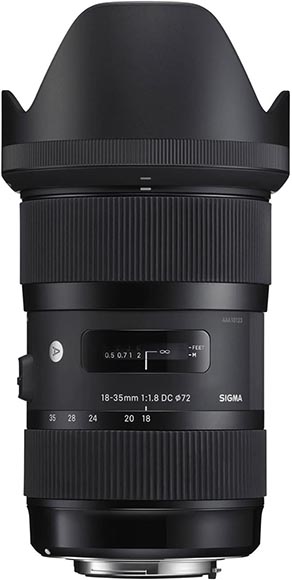 A black Sigma 18-35mm f/1.8 DC HSM zoom lens with a 72mm filter thread and a focus distance meter.