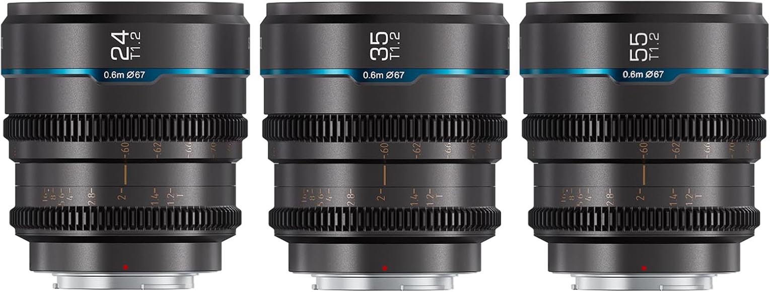 Three black camera lenses of different focal lengths (24mm, 35mm, 50mm) are lined up side by side. Each lens features blue accents and detailed markings, with a silver mount at the base.