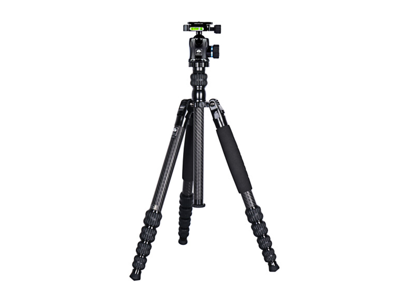A black tripod with adjustable legs, foam grips, and a bubble level on top.