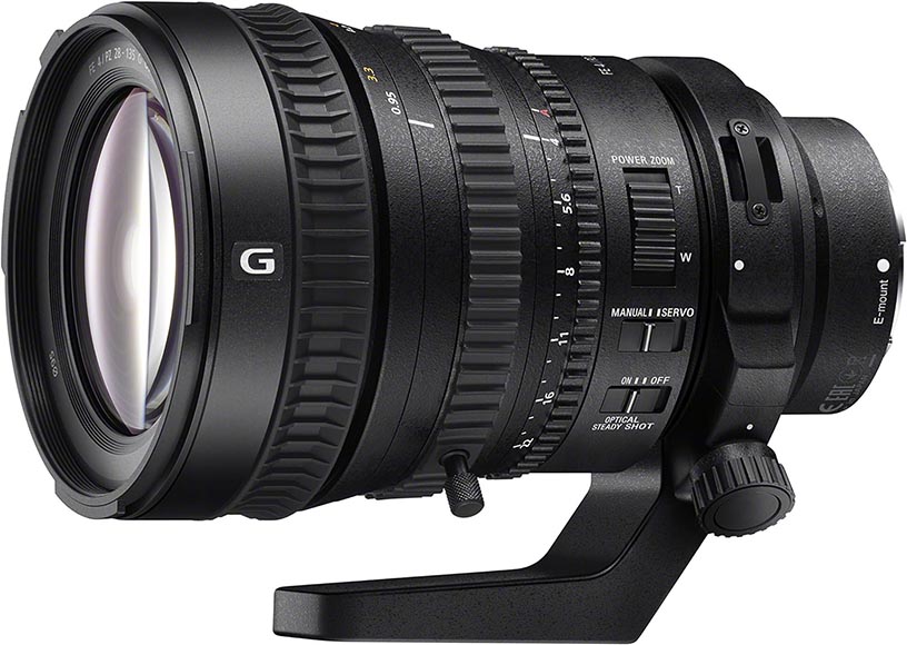 Close-up of a black camera lens with various adjustment rings and a mounting bracket attached at the bottom. The lens has markings and letters on it, indicating different settings and features.