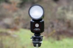 A small light is sitting on top of a tripod.