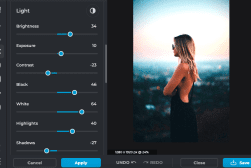 A photo editing interface showing light adjustment sliders on the left and an image of a woman in a black dress standing outdoors on the right.
