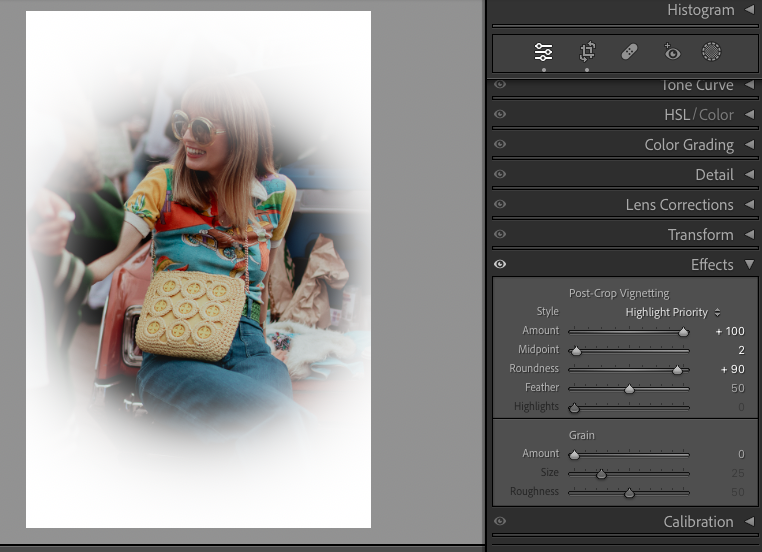A person with long hair wearing sunglasses and a colorful shirt sits smiling with a cream crocheted bag. The image is being edited in photography software, with vignette and grain settings visible.